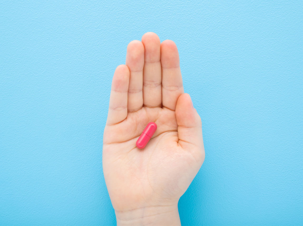 vaskapszula egy gyermek kezében